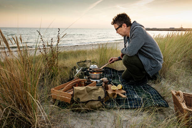istock Fisherman cooking his catch at the beach 1073244948