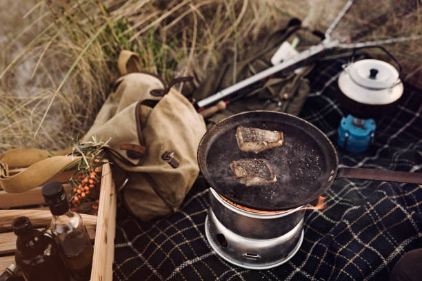 istock Fisherman cooking her catch at the beach 1073245216