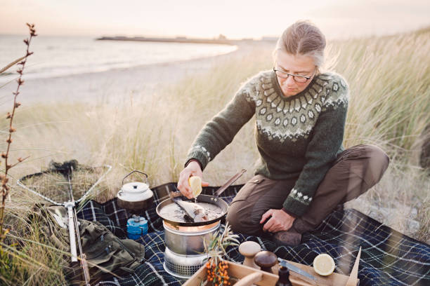 istock Fisherman cooking her catch at the beach 1073245466