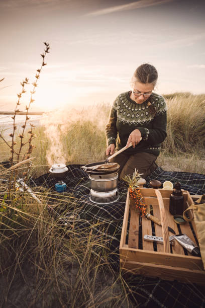 istock Fisherman cooking her catch at the beach 1073245474