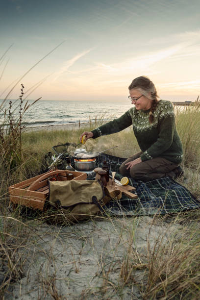 istock Fisherman cooking her catch at the beach 1073245596