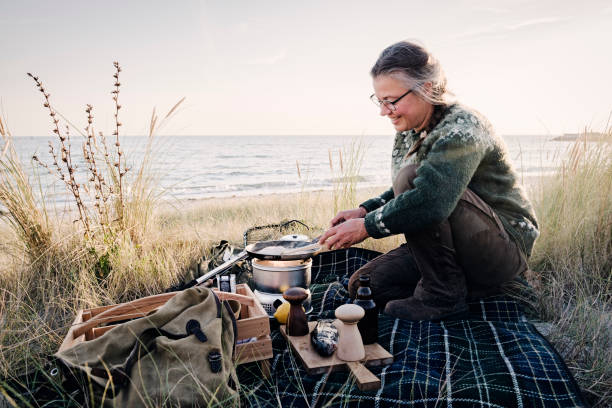 istock Fisherman cooking her catch at the beach 1073245604