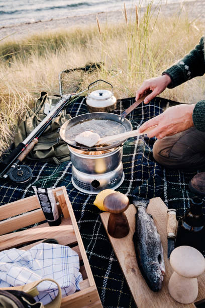 istock Fisherman cooking her catch at the beach 1073245746