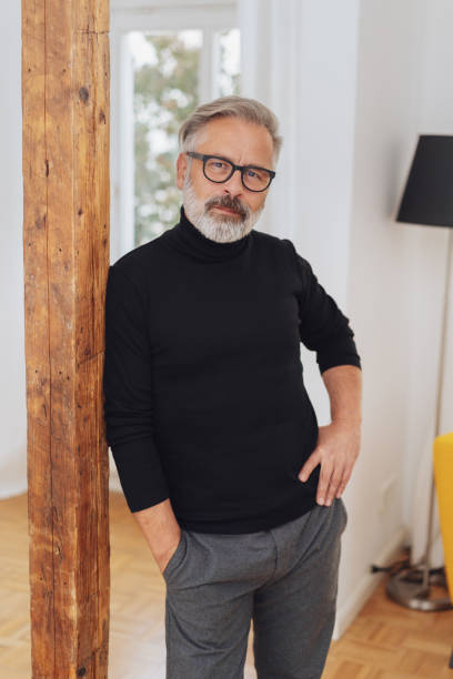 istock Thoughtful relaxed man staring at the camera 1073249784