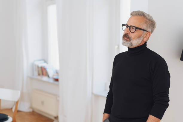 istock Bearded man with glasses wearing polo neck jumper 1073249918