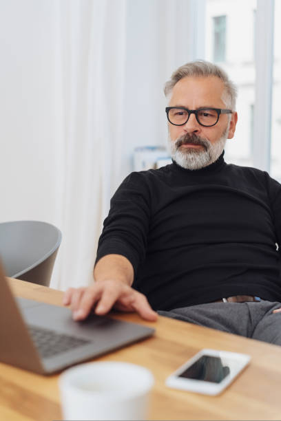 istock Businessman working at a laptop in the office 1073253724