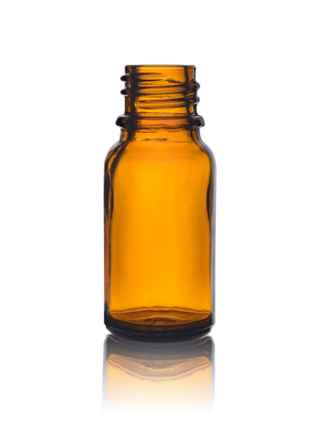 istock empty bottle for drugs from brown glass with reflection on a white background 1073254950
