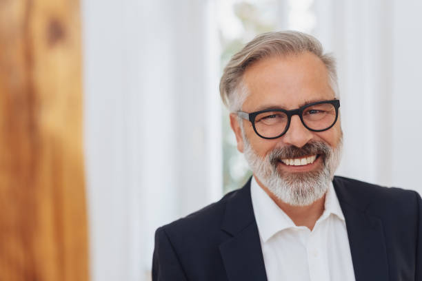 istock Portrait of an elegant middle-aged man smiling 1073257320