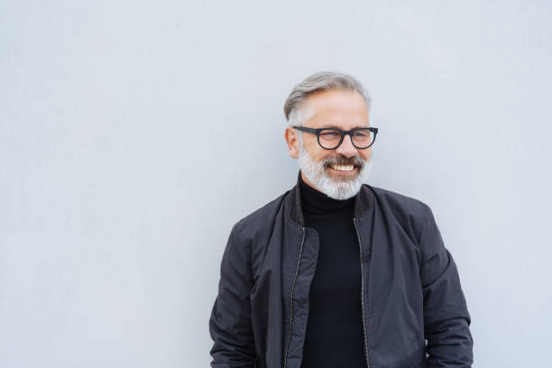 Attractive bearded older man smiling happily
