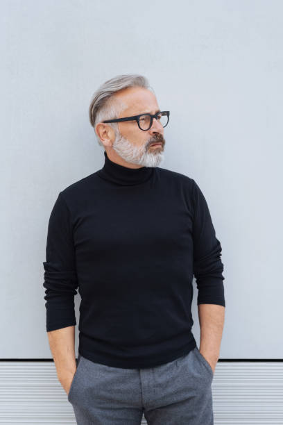istock Man standing staring off to the side 1073259078