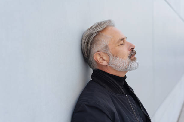 istock Middle-aged bearded man taking a moment to relax 1073259330