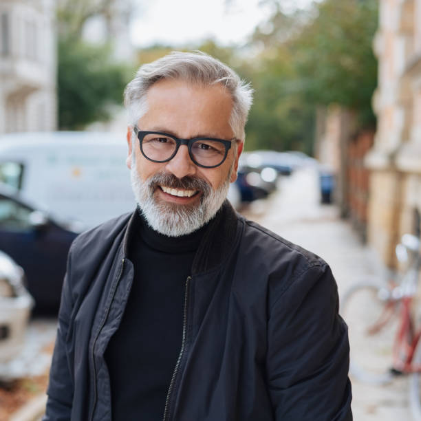 istock Attractive bearded man with lovely friendly smile 1073261374
