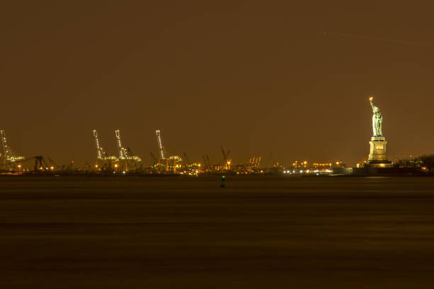 istock statue of liberty at night 1073261556