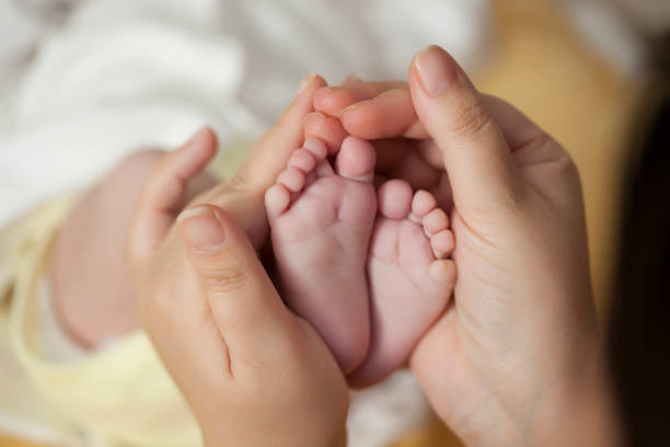 istock newborn baby feet 1073264088
