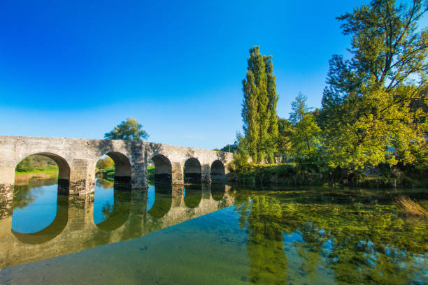 istock Croatian rivers, old stone bridge over Dobra 1073266728