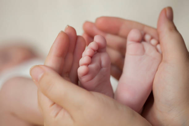 istock newborn baby feet 1073267260