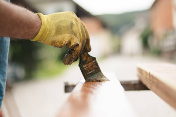 painting and wood preservation - carpenter restoring furniture wood imagens e fotografias de stock