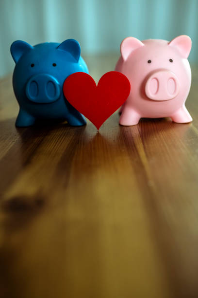 istock Piggy Banks on Wooden Table 1073267772