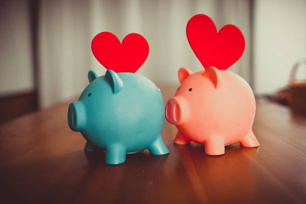 istock Piggy Banks on Wooden Table 1073267790