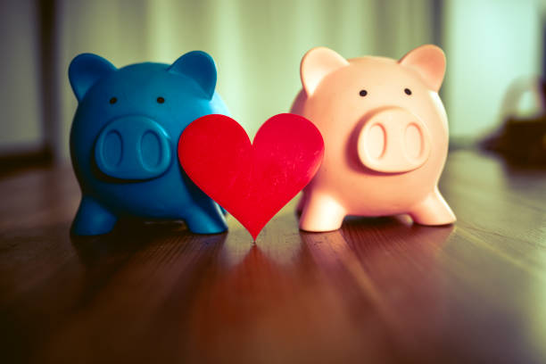 istock Piggy Banks on Wooden Table 1073267792