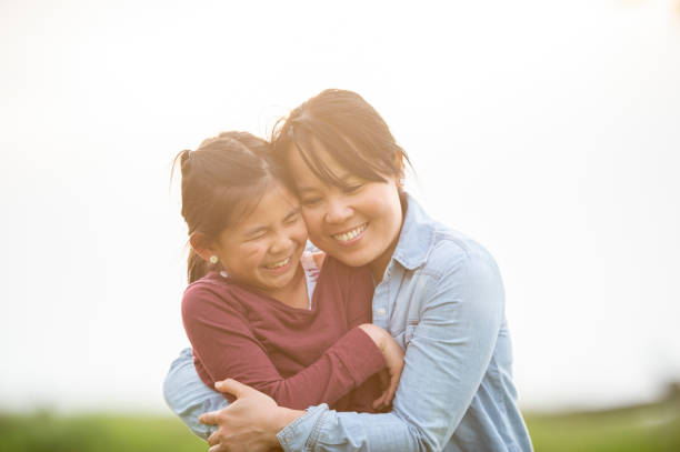 istock Mother And Daughter Hugging 1073267838