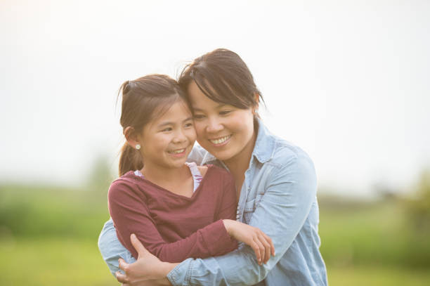 istock Girl Sitting With Mother 1073267844