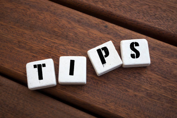 istock TIPS Concept with alphabet blocks on wooden table. 1073273598