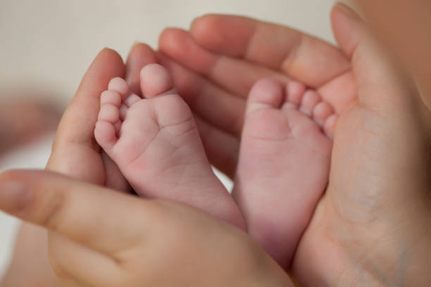 istock newborn baby feet 1073273702