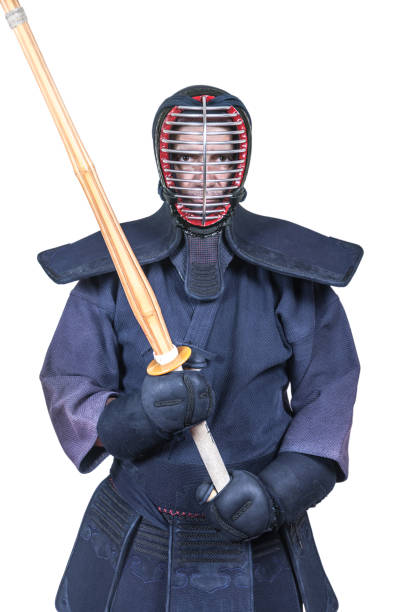istock swordsman in attacking position and protective equipment 'bogu' and bamboo sword 'sinai'  for Japanese fencing Kendo training 1073277116