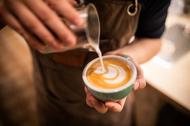 Barista make coffee cup latte art