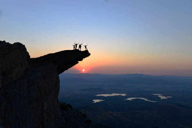 istock achievements of climbers in cliffs, risky and dangerous places 1073280778