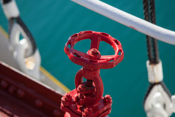 close up view of a  traditional sailing ship detail - red valve with natural light