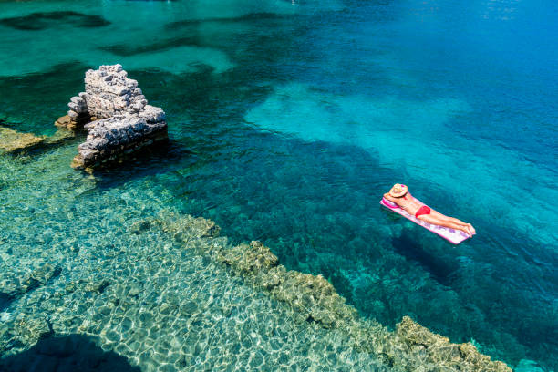istock Woman is lying on the sea bed. 1073293156