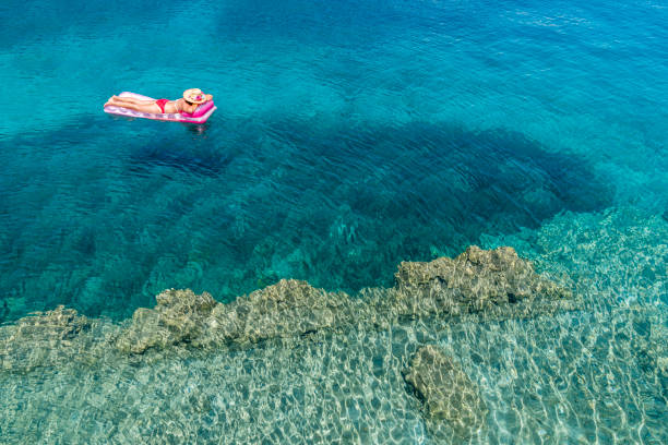 istock Woman is lying on the sea bed. 1073296710