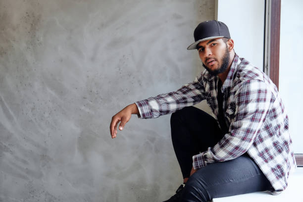 istock Black man posing near window with natural light. 1073296778