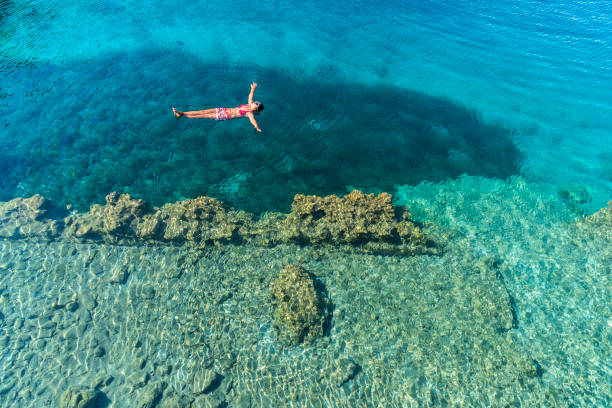 istock Woman is lying on the sea bed. 1073305920