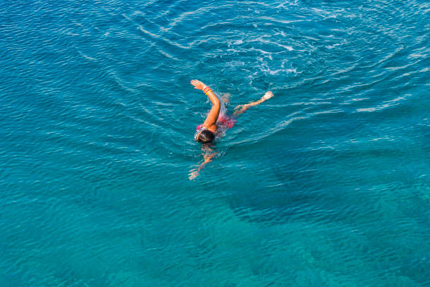 istock Woman is lying on the sea bed. 1073307140