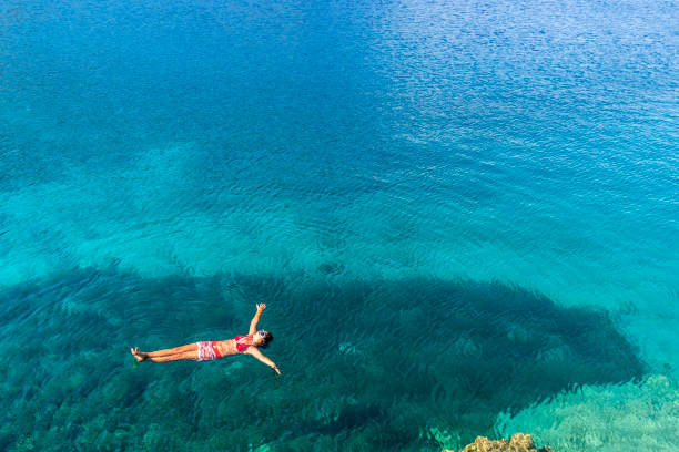 istock Woman is lying on the sea bed. 1073308516