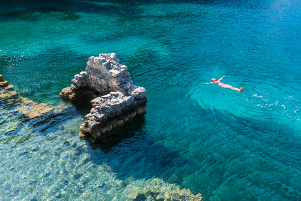 istock Woman is lying on the sea bed. 1073310956