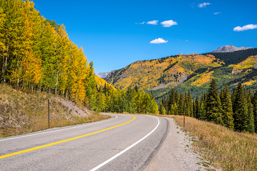Traveling north through the autumn color in the San Juan Mountains. Telluride, Colorado.