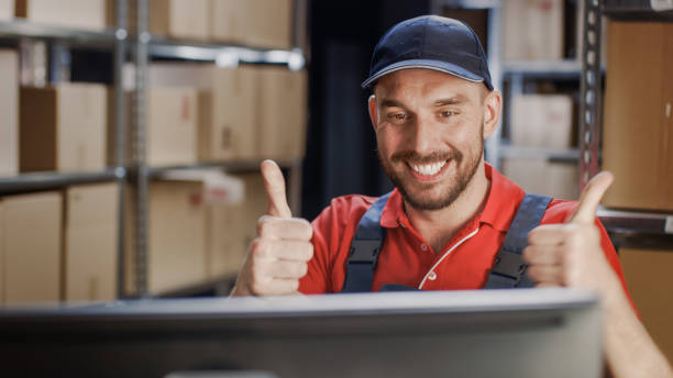 istock Worker Uses Personal Computer Wins Big and Celebrates Success With Thumbs Up Gesture. 1073312002