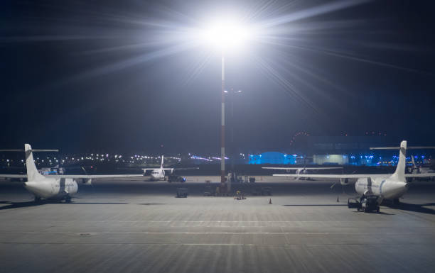 istock Passenger planes at night airport. 1073312244