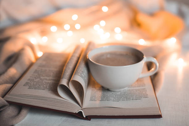 istock Cup of coffee with book 1073313872
