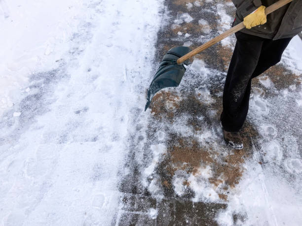 istock Worker sweep snow from road in winter 1073317288
