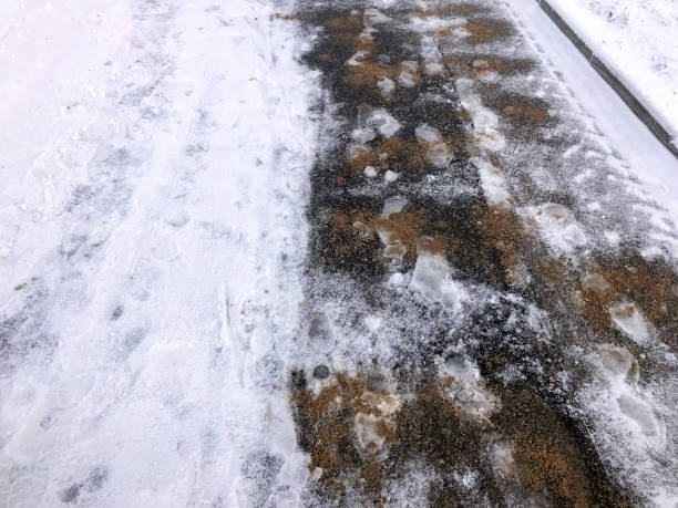 istock Slippery ice and snow on the sidewalk 1073317662