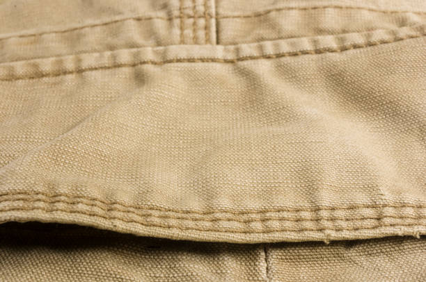istock clothing items washed cotton fabric texture with seams 1073327018