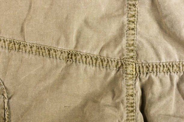 istock clothing items washed cotton fabric texture with seams 1073327158