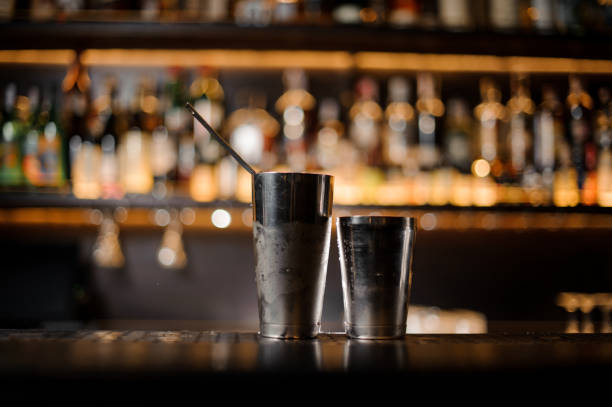 istock Steel shaker standing on the empty bar counter 1073333224