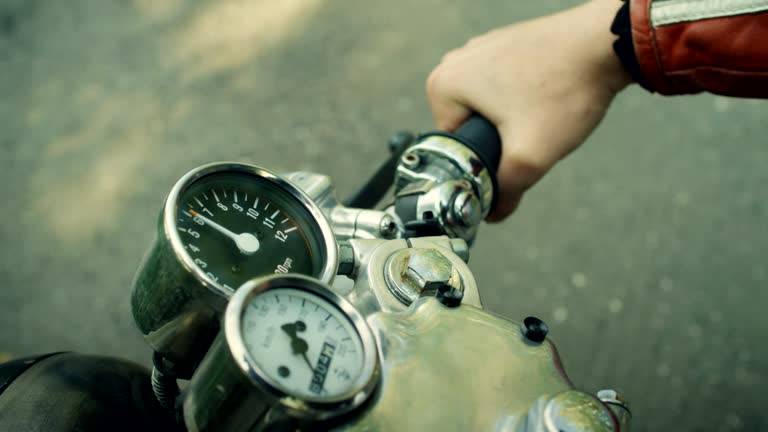 Man riding vintage motorcycle. Machine details