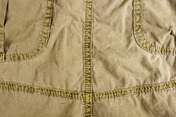 istock clothing items washed cotton fabric texture with seams 1073339714